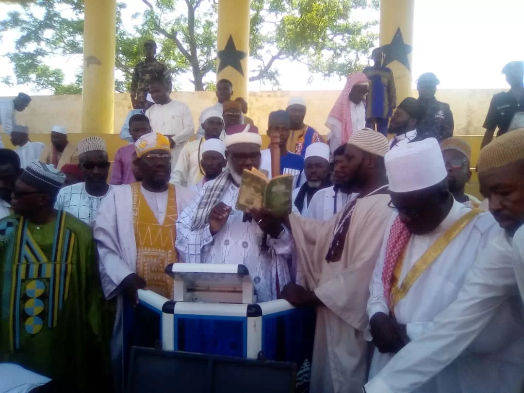 Imam Ahmed Alhaji Yahaya Nanjo (holding a book) doing a recitation at the Jubilee Park