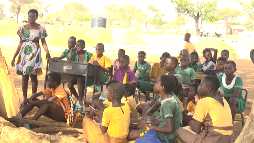 KANDIGA: Pupils of Amenga-Etego Primary School sit on stones to study under trees